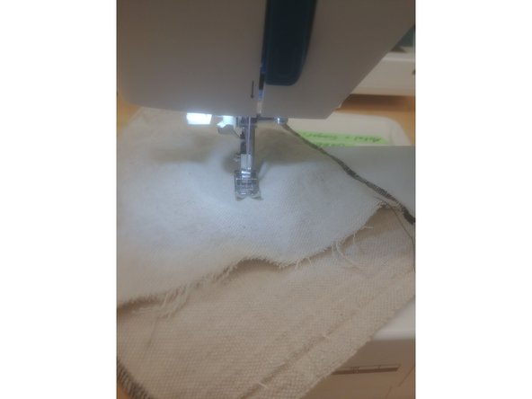 Slide your fabric into the machine, under the needle.