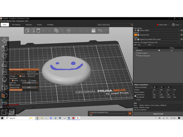 The next tool is Fuzzy Skin. Fuzzy skin adds a jitter to the Nozzle as it prints resulting in a fuzzy surface texture on the finished print. Left Click dragging add areas of blue, like the second image, where fuzzy skin will be placed. A visible example of this is in the third image, where the left half of the object has fuzzy skin.