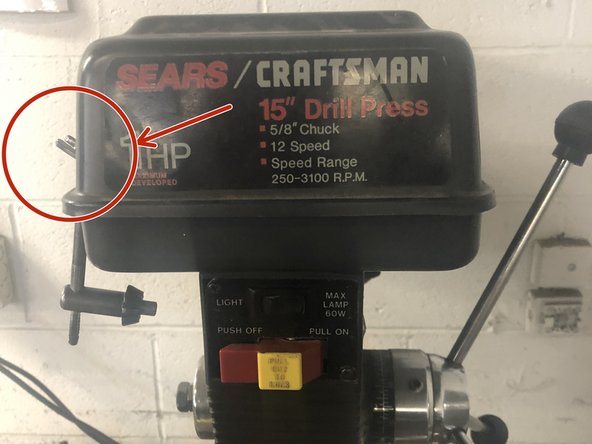 Locate the chuck key on the side of the machine.