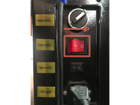 Flip the laser enable switch to the off position.