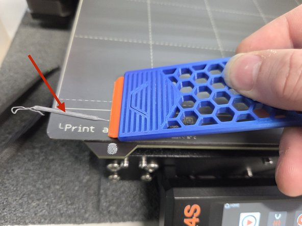 If a print is particularly small using a bed scraper like the first image may be the best option.