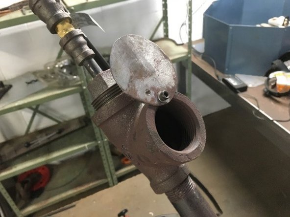 Once the inside of the forge is consistently incandescent, open choke plate until air intake is unobstructed.