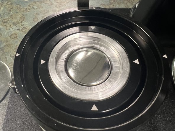 Place the metal button top into the LEFT mold with the curved smooth side facing up.