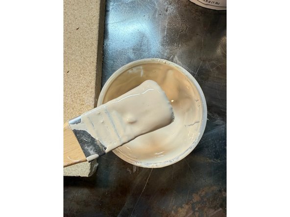 Items needed to mix kiln wash: A plastic container, a plastic/silicone spoon or silicone spatula, water, a wide soft bristle paint brush and a dust mask. Make sure the items will not be reused for food or drinking.