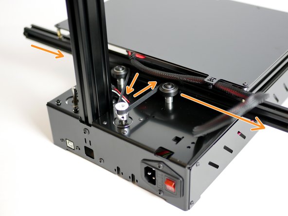 Weave the belt around the rollers and puley as shown in the image.