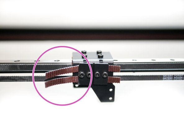 Grip the belts with the pliers and twist against the carriage to tighten.