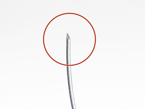 Use a pair of scissors or side cutters to cut a sharp point to your filament.