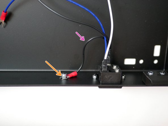 Fix the earth cable (shorter black cable) from the socket to the frame.