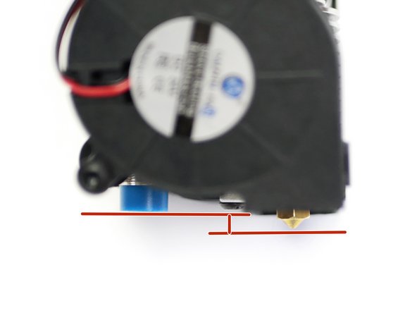 The bottom of the probe should be between 1-2mm above the tip of the nozzle.