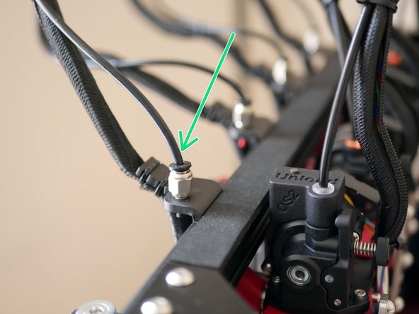 To fix the tubing to the Orbiter extruder the orange clip needs to first be removed, the PTFE tube inserted and then the orange clip be pushed back on to hold it in place.