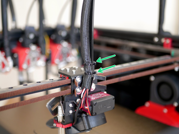 Use cable ties to fix the cable support (the shorter 65mm support) to the cable loom, you may need to pull some of the loom from the base to fix onto the cable support.