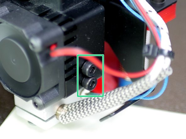 You will likely need to raise the platform manually so that the piece of paper can be gripped between the nozzle and the bed.