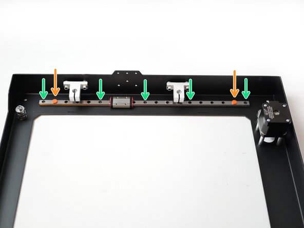 Remove a rail from its packaging and move the red carriage stoppers in one hole space.