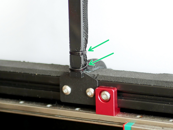 Use cable ties to fix the cable support (the shorter 65mm support) to the cable loom, you may need to pull some of the loom from the base to fix onto the cable support.
