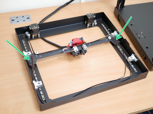 Unfasten the bolts holding the gantry to the rails.