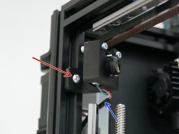 Feed the USB cable up from under the base and connect it to the camera.