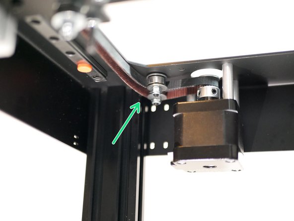 Next, wrap the belt around the rear left idlers as shown.