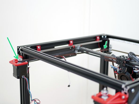 From the front idlers loop the belt around the pulley on the rear motor.