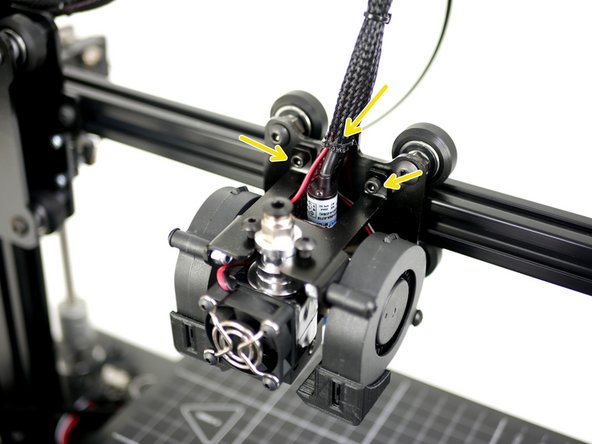 Cut the cable tie holding the cables to the carriage and remove the two M3 x 8mm bolts.
