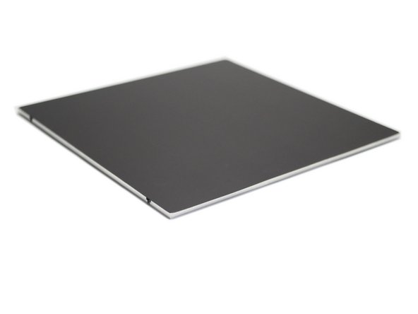 Carefully pull the backing paper whilst pressing the magnetic sheet down.