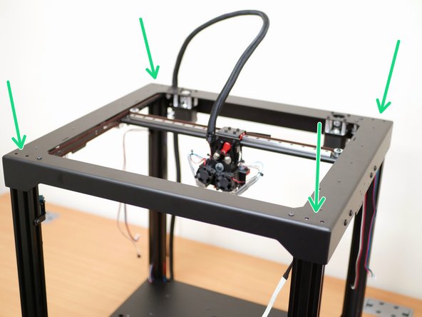 Before starting this step we recommend making some space to the left of the printer, enough to place the top panel down.