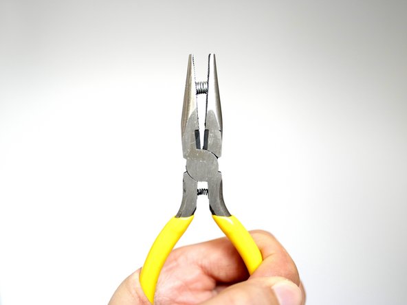 Compress each of the springs with pliers to reduce their length, this will make it easier to install them.