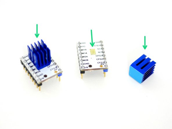 Prepare the two TMC2100 stepper drivers by removing them from their packaging and sticking on the Heatsinks as shown in the first image.