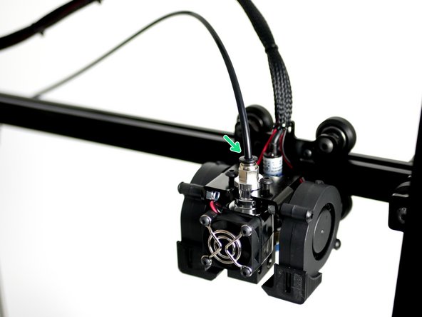 Insert one end into the PTFE Tubing into coupling on the Extruder.