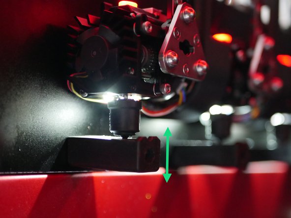 Slide the print heads onto the docking pins and adjust the silicone docks so that they apply slight upward pressure on the nozzle.