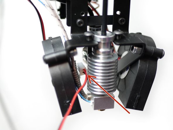 Begin by feeding the fans cable into the left side of the mount as shown.