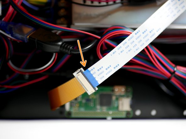 Connect to the other side of the extender to the Pi cam cable from the Pi Cam like shown with the blue side facing up.