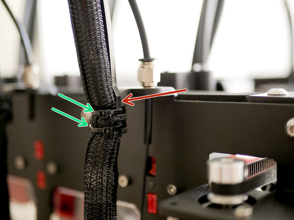 Secure the print head cable support guides to the print head cables and PTFE tubes using cable ties.