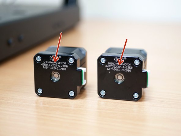 Take the two motors from the old Top Panel Assembly. The motor number should have a 205 in it.