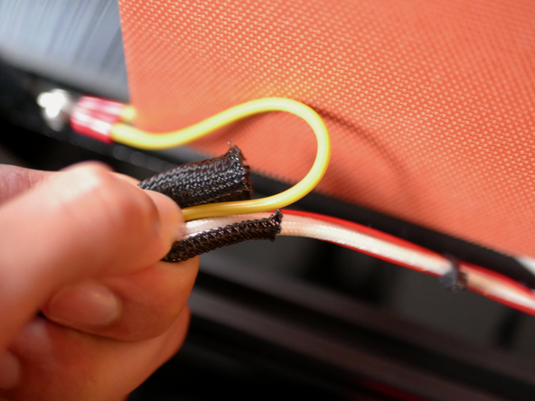 Cut 70cm of the braided sleeving and wrap the heater and earth cables with it.