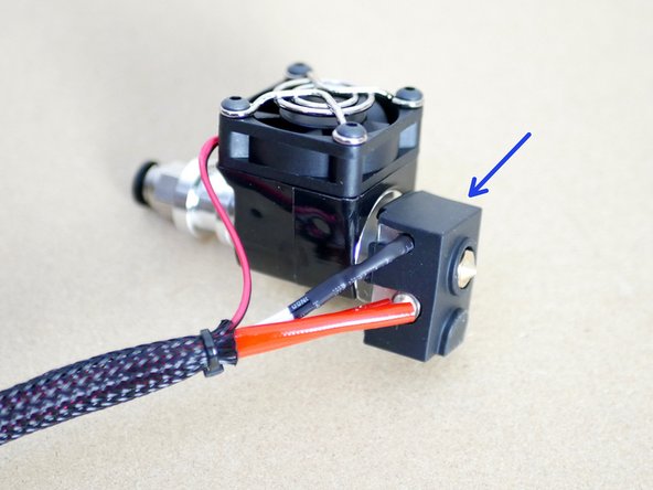 Finally fix the silicone sock cover onto the heater block.