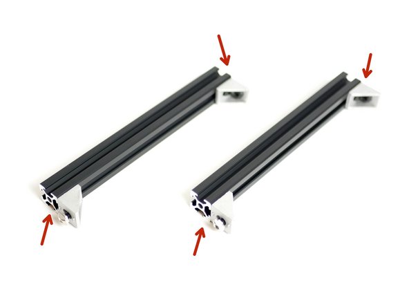 Fix the corner bracket assemblies on to the two 2020x189mm beams as shown in the image.