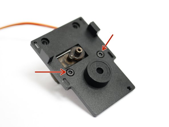 Begin  by preparing the backplate with two M3 x 8mm bolts as shown.