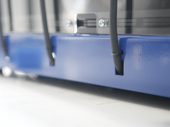 Secure the print head cables to the base with cable ties.