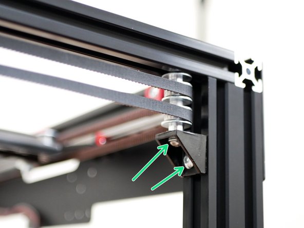 Fix the front idler assemblies to the frame.