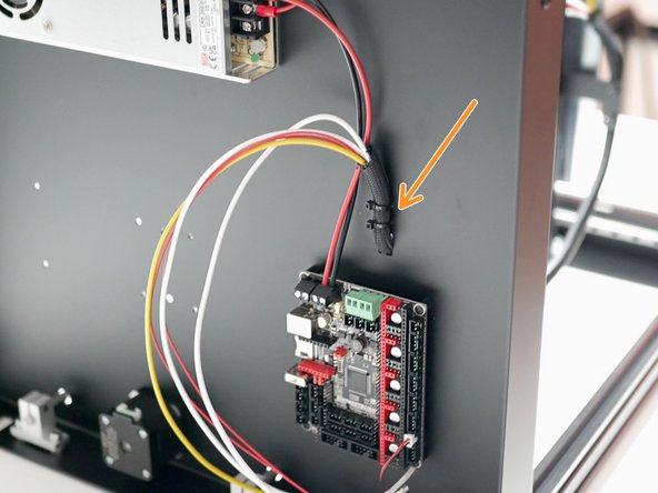 Fix the cables to the base with cable ties as shown.