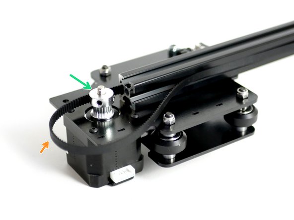 Drop onto the other side of the gantry a pulley onto the Y-Motor shaft. Match the orientation of the pulley in the image.