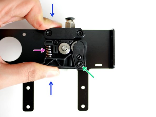 Place in position the Extruder Spring on the Back Plate.