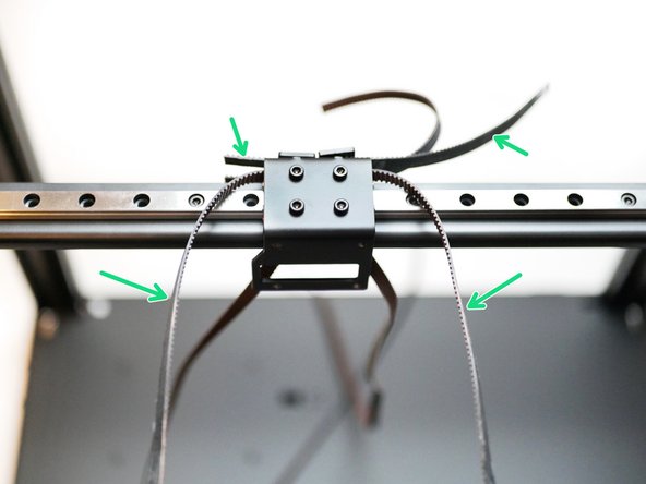 Take the upper belt loop and swing it over the front of the gantry.