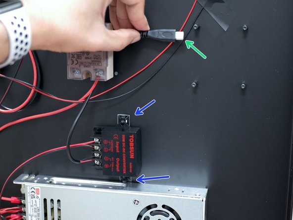Fix the 5V converter to the base with the cable tie mounting pads.