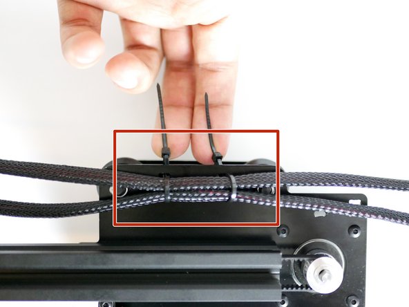 Wrap the cable ties around both of the cables from the Y-Carriage and tighten.