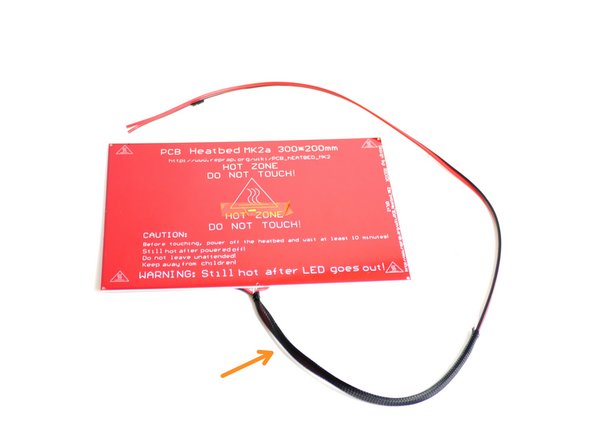 Slide the braided sleeving onto the heated bed cables.