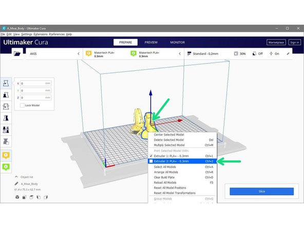 Right click on one of the models and set its extruder to Extruder 2.