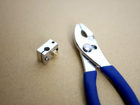 You should need to use the pliers to screw the nozzle on, if it threads on too easily you need to add more layers of the PTFE tape to the nozzles thread.