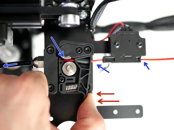 Place the spool of filament onto the spool holder and feed the filament through the filament sensor.