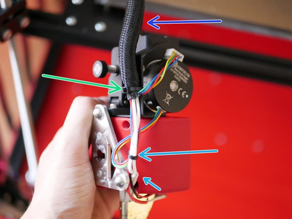 Route the cables from the print head to the rear of the fan case. Use a cable tie to hold them together.